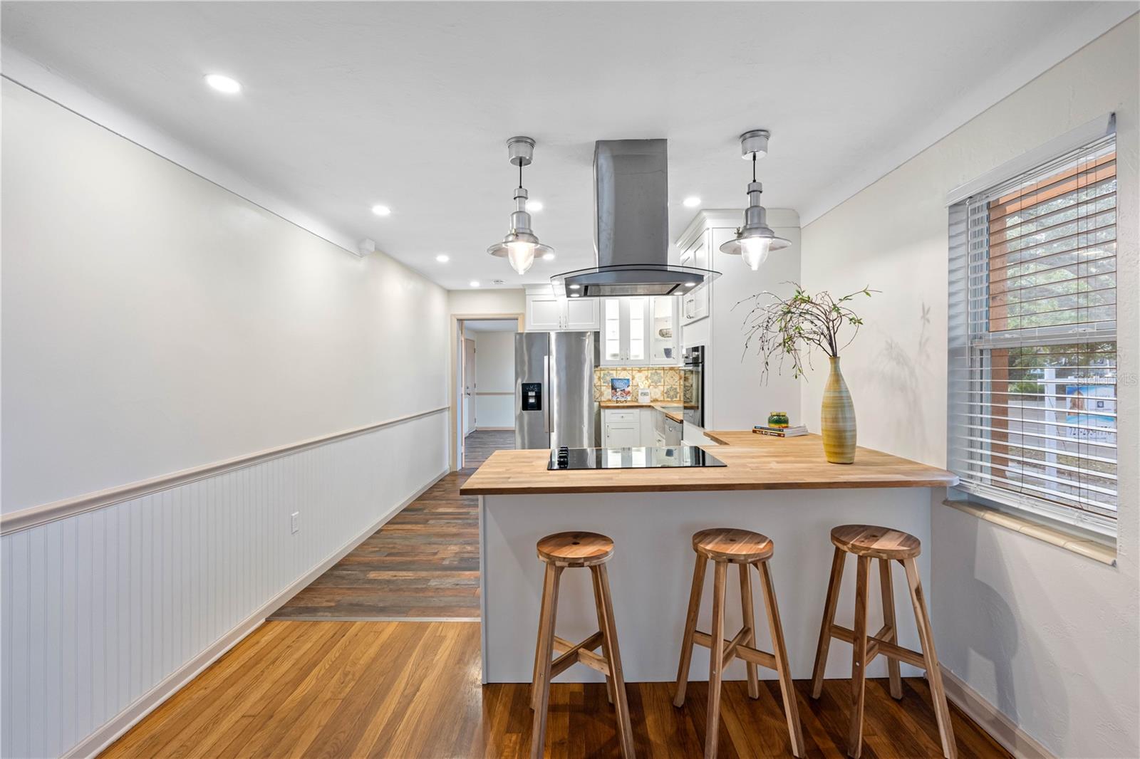 Waterproof kitchen flooring new stainless-steel appliances, butcher block counters.