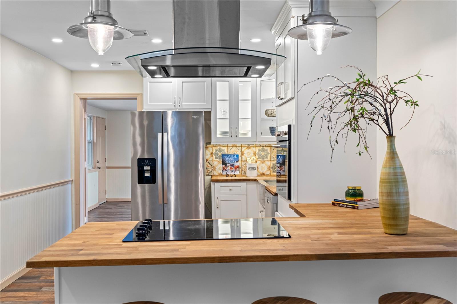 Kitchen open to living and dining areas.