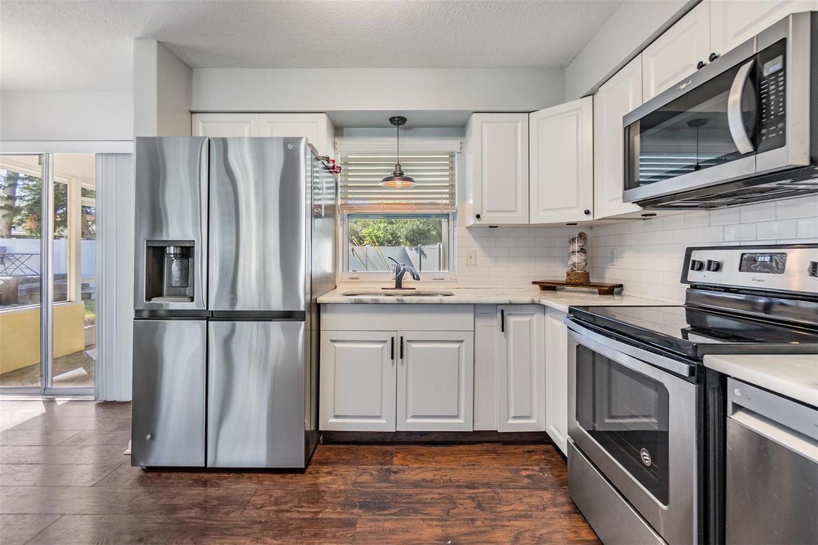 Large double refrigerator in kitchen.