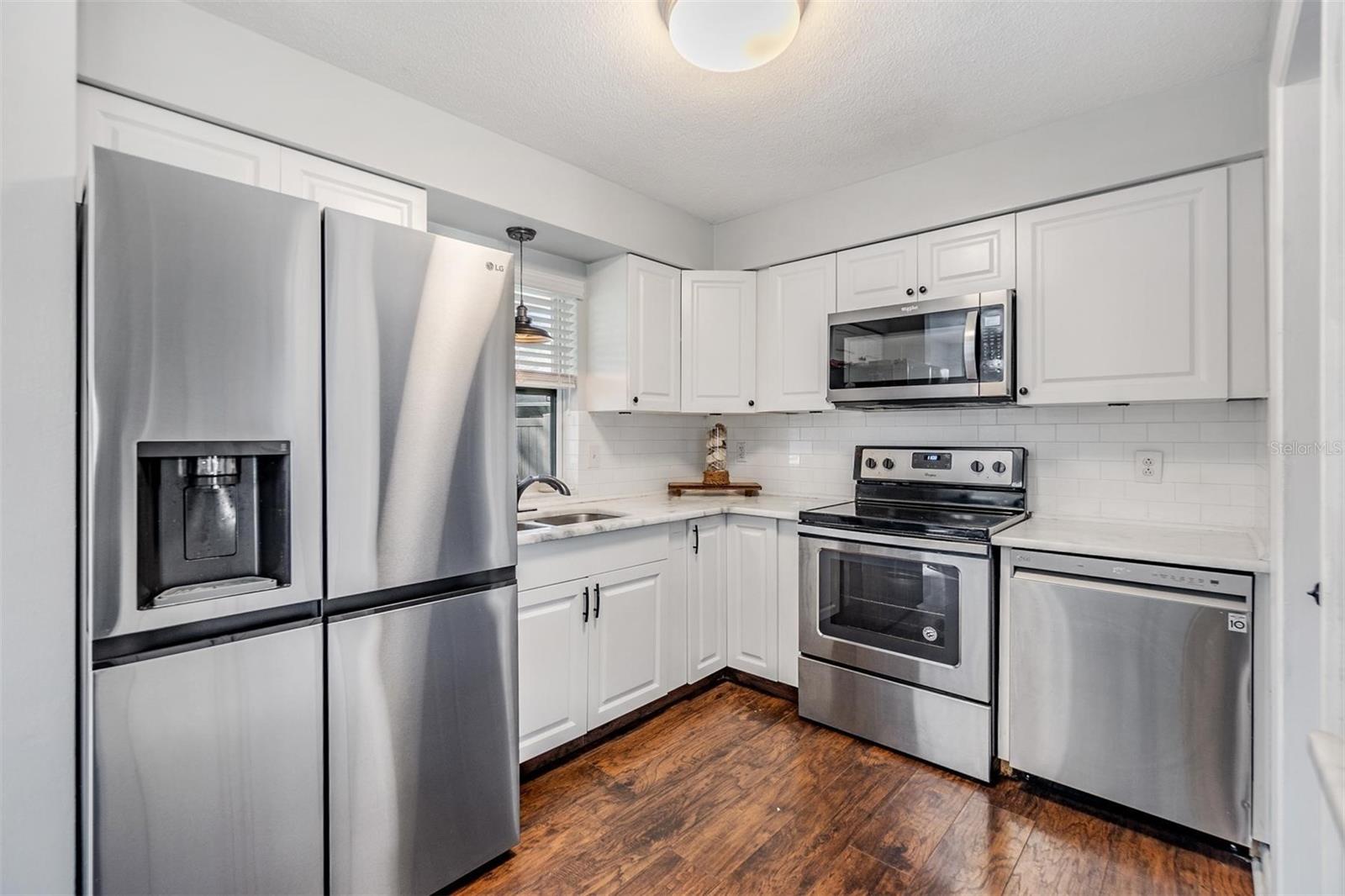 Kitchen with newer appliances.