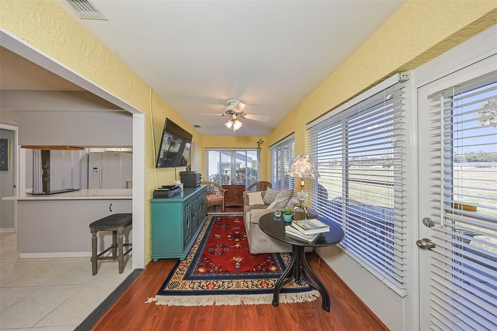 Florida Room is connecting to both the kitchen and the living room.