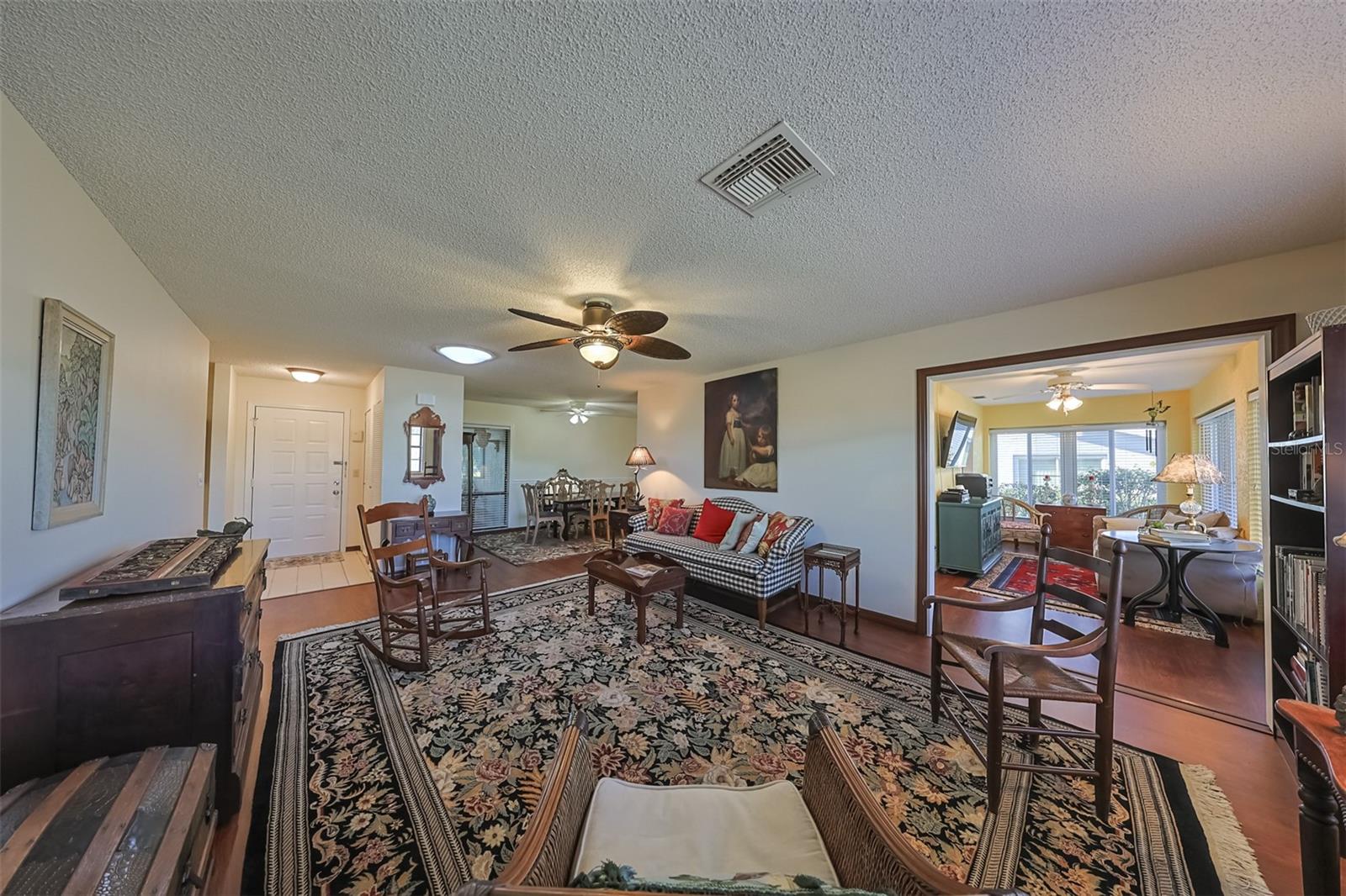 Living Room is large and spacious with easy access to the Florida room and dining room.