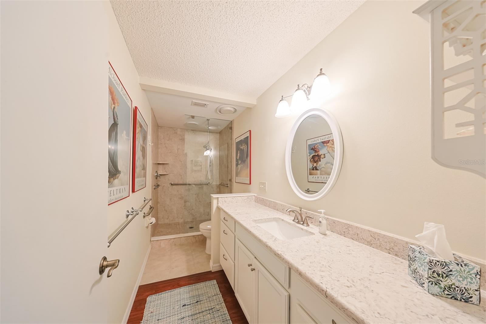 Owners Bathroom has been updated and is sparkling clean.  Neutral tones with a large walk-in shower, granite counters and soft close drawers gives this space a spa-like feel.