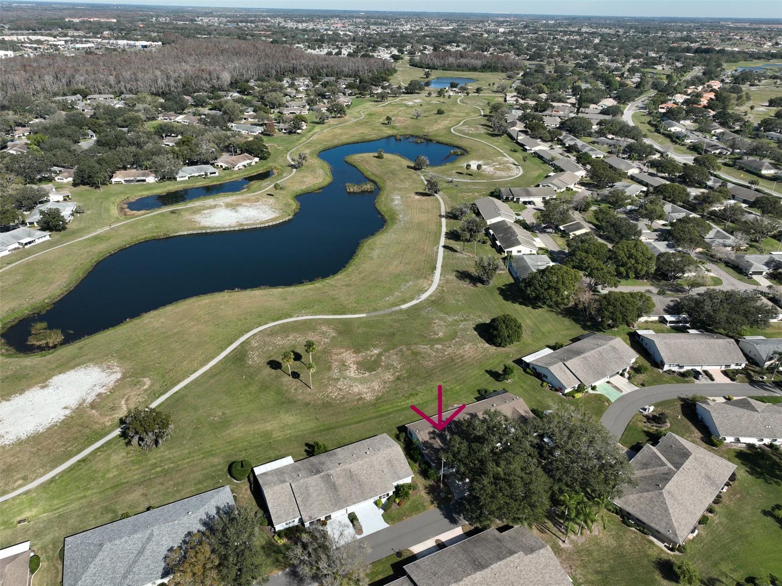 No Backyard Neighbors! - Ariel view showing that the home is located on a retired golf course.  This neighborhood is known for its park-like feel, due to the vast green space between the homes, large trees and park benches.