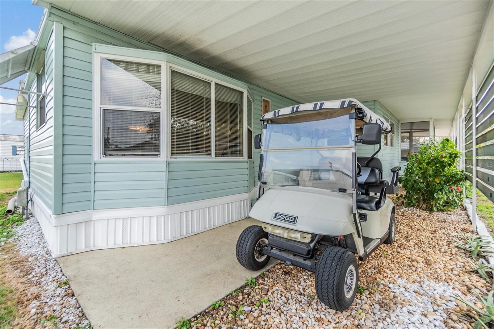 Golf cart included in sale.