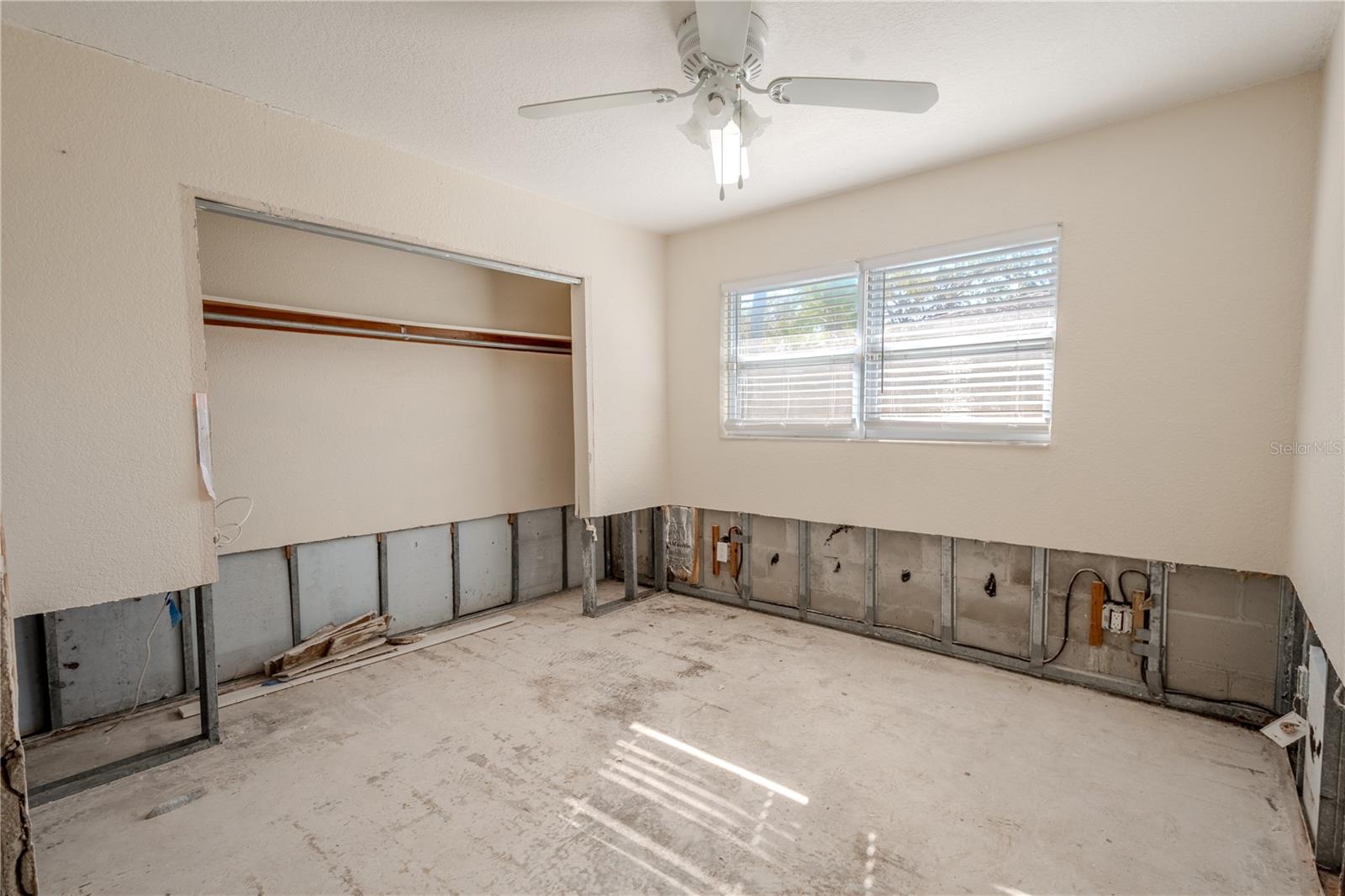 2nd bedroom features built-in closet and ceiling fan.