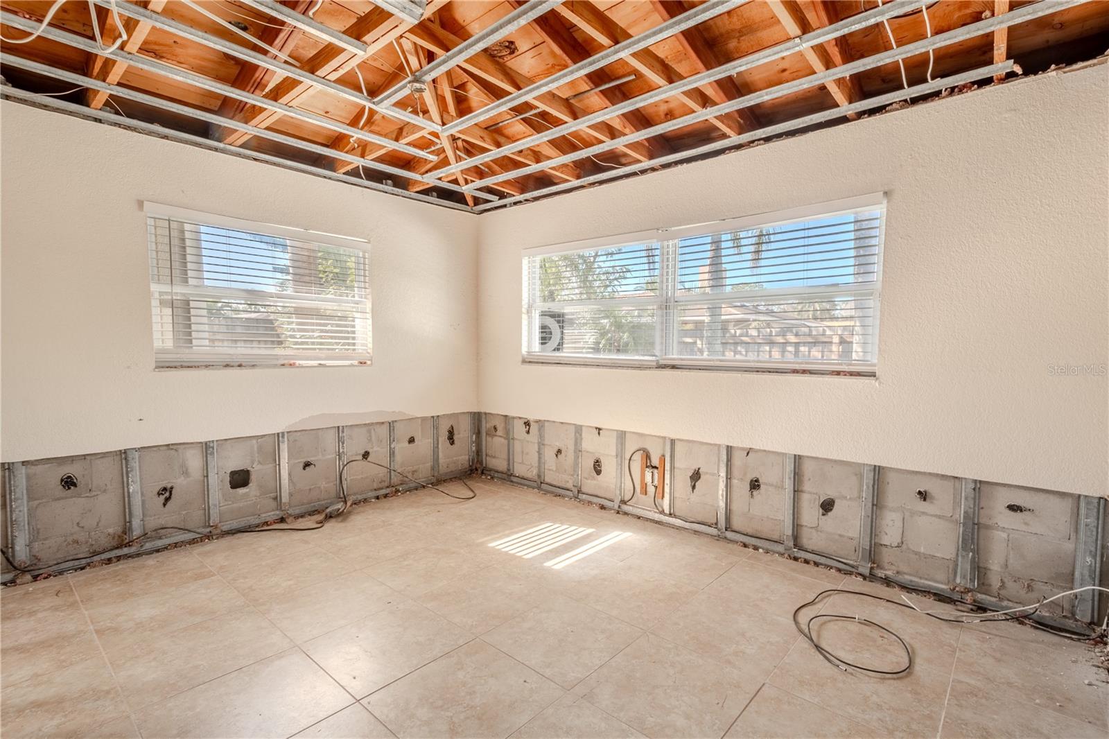 4th bedroom has a tile floor and  two windows for plenty of natural light.