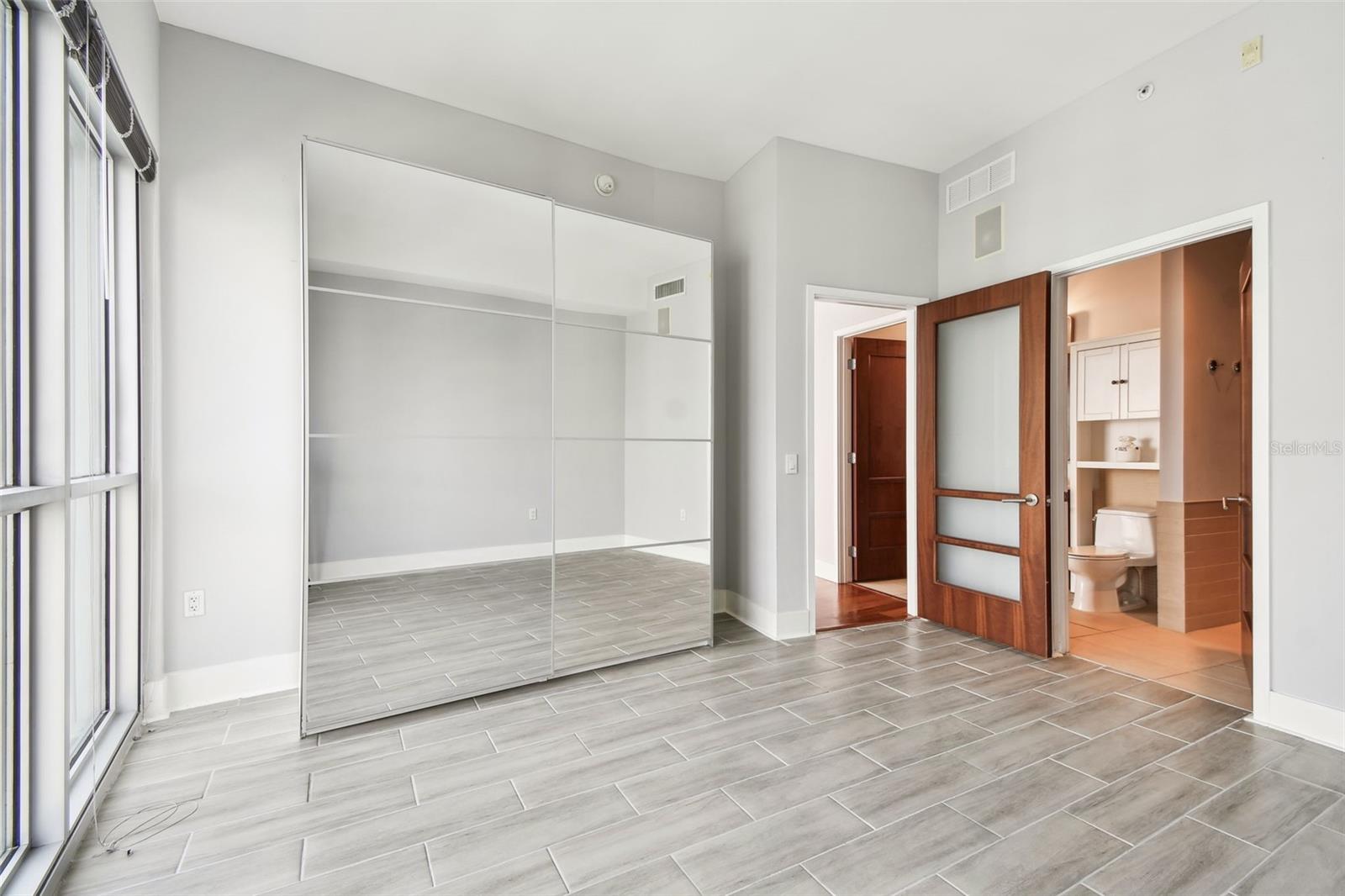 Bedroom with new tile flooring.