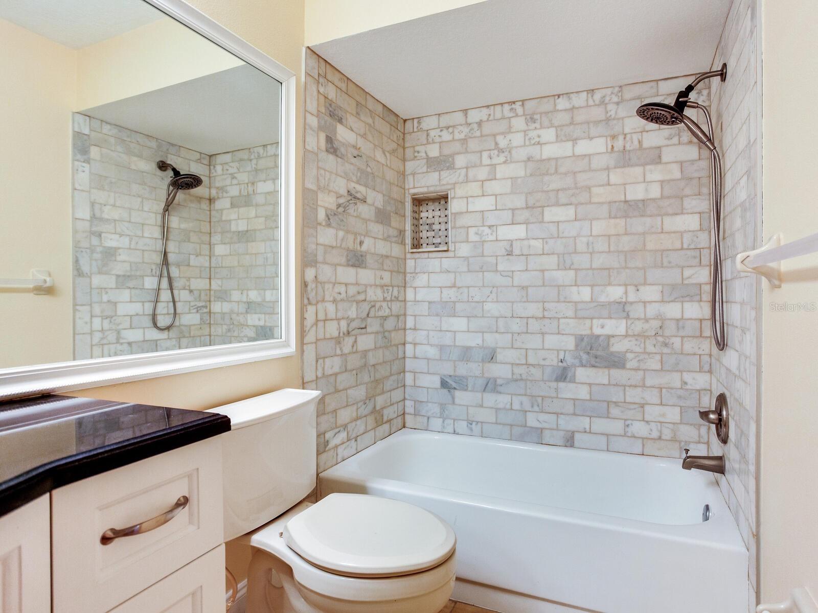 Second bath with tiled tub/shower