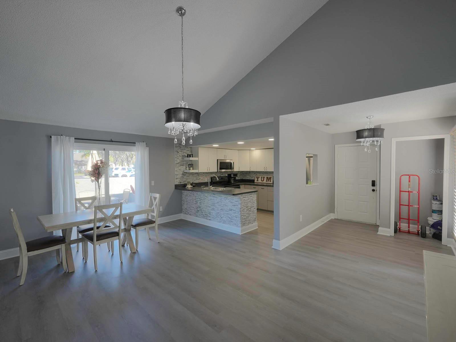 Vaulted Ceiling w/Glamorous Light Fixtures