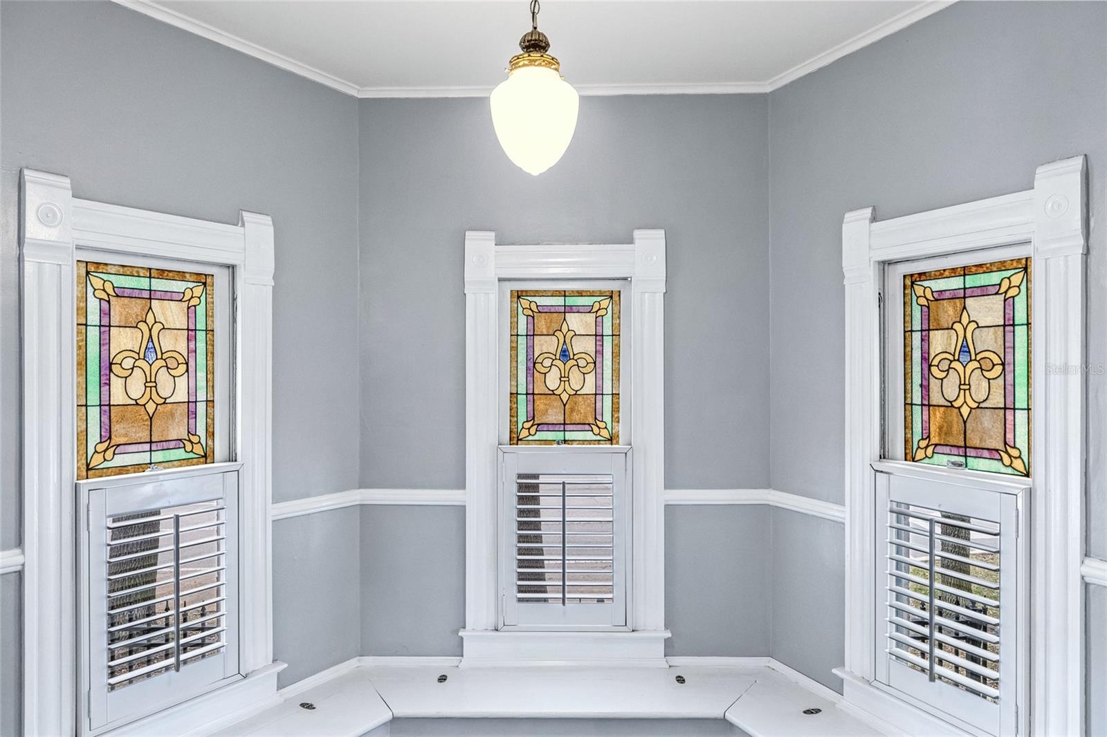 Beautiful stained glass windows are original to the home.