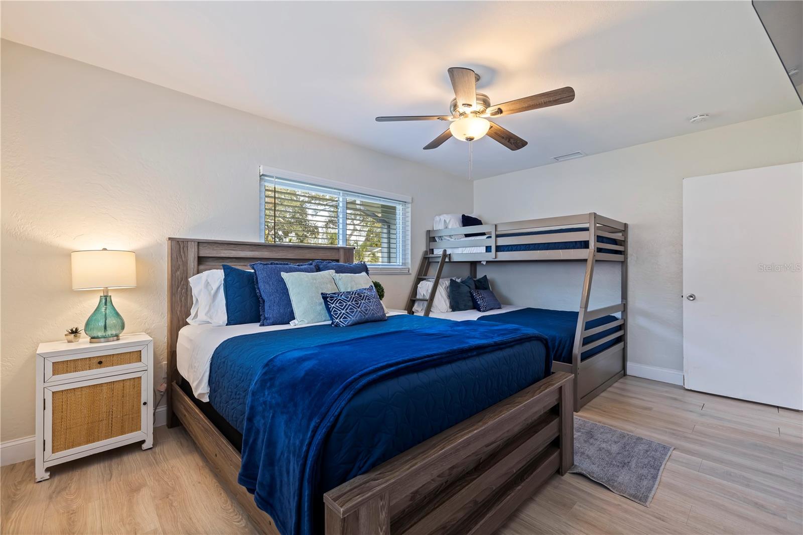 Second bedroom with a queen bed and bunks. Plenty of room for everyone!