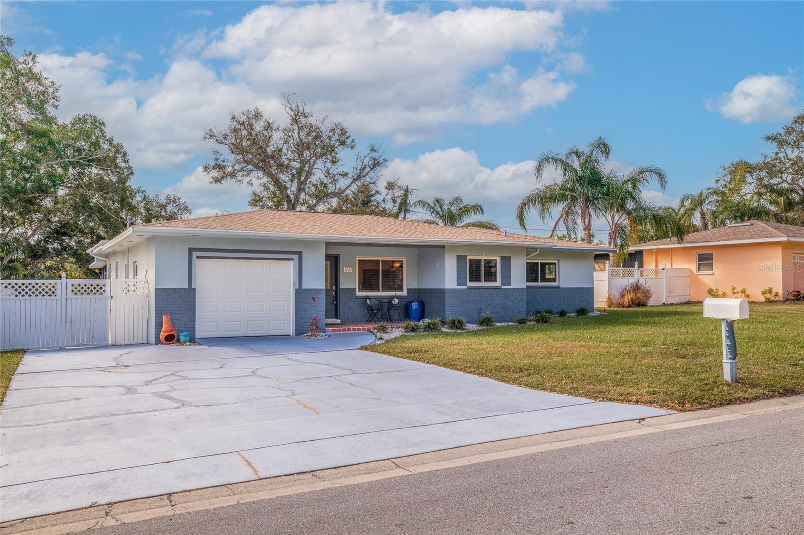 Extra wide driveway and a garage.