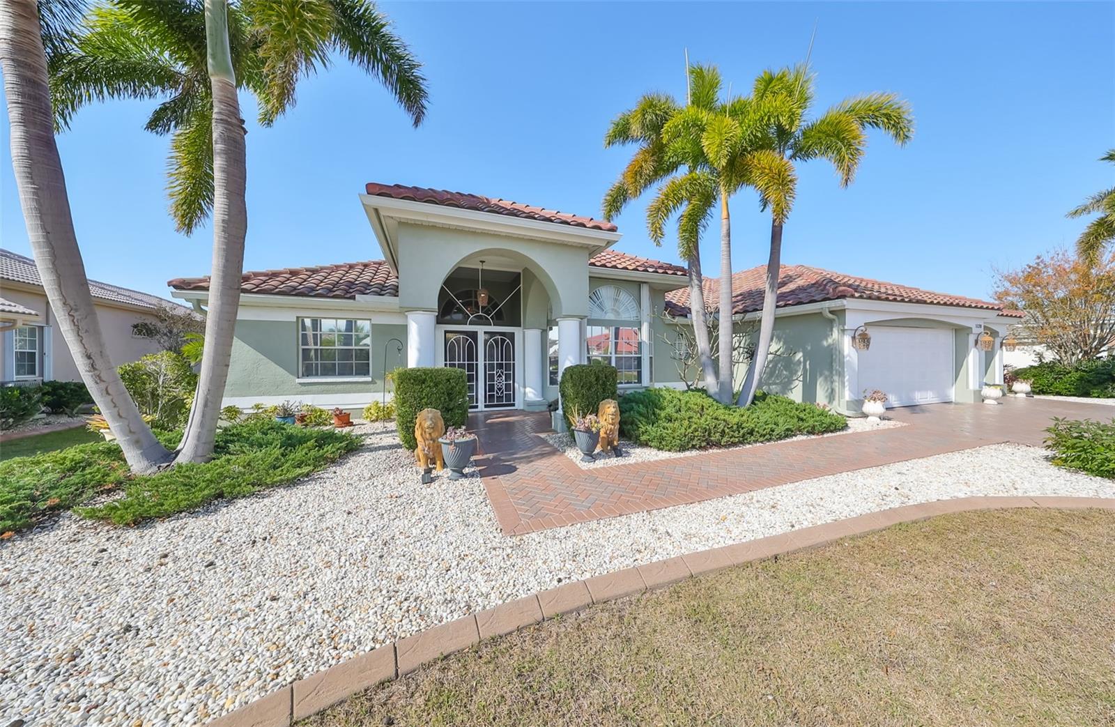 Front, Upgraded Concrete Curbing, Brick Paved Drive & Walkway & 3 Car Garage