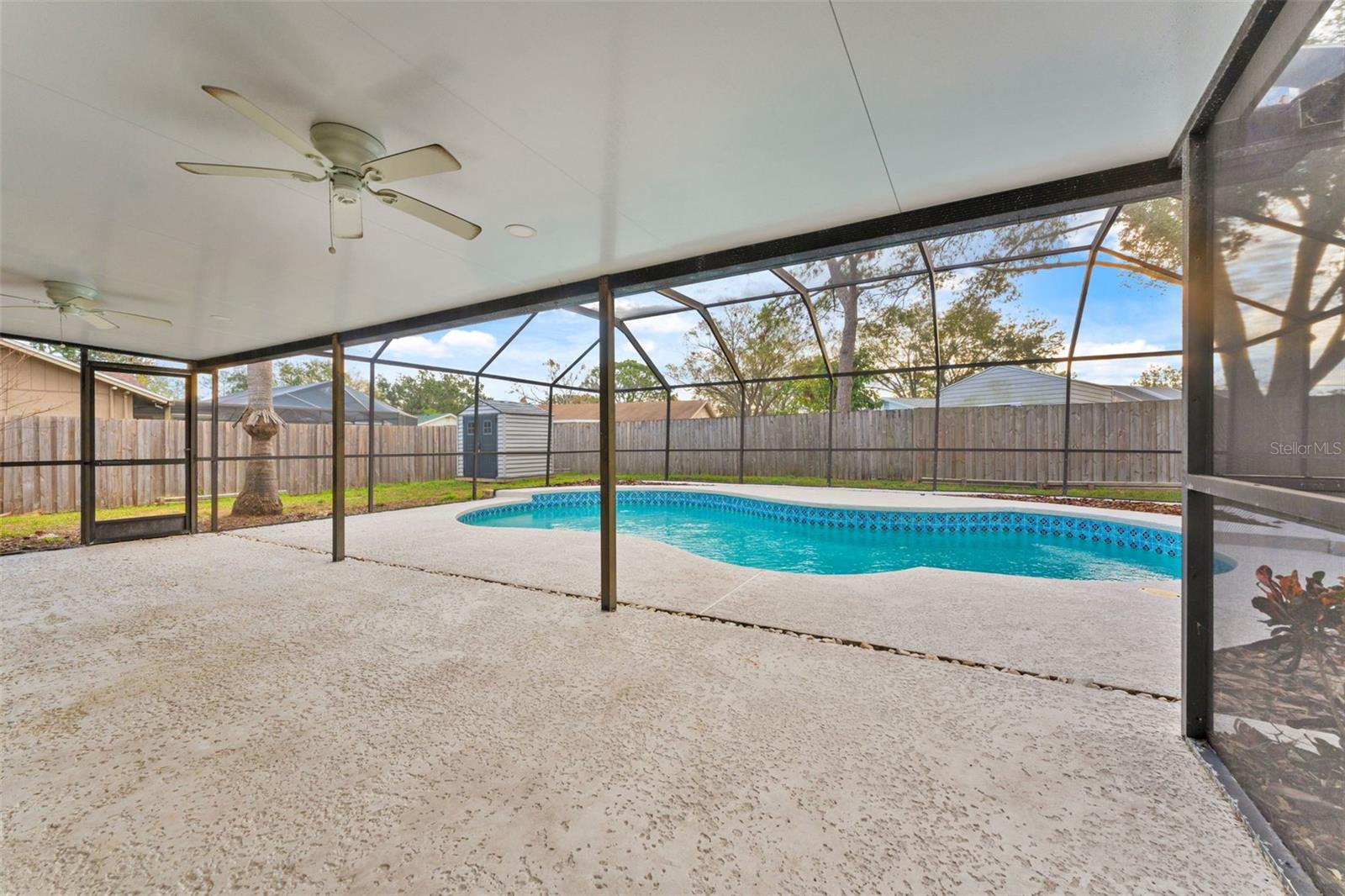 Covered back lanai with screen pool