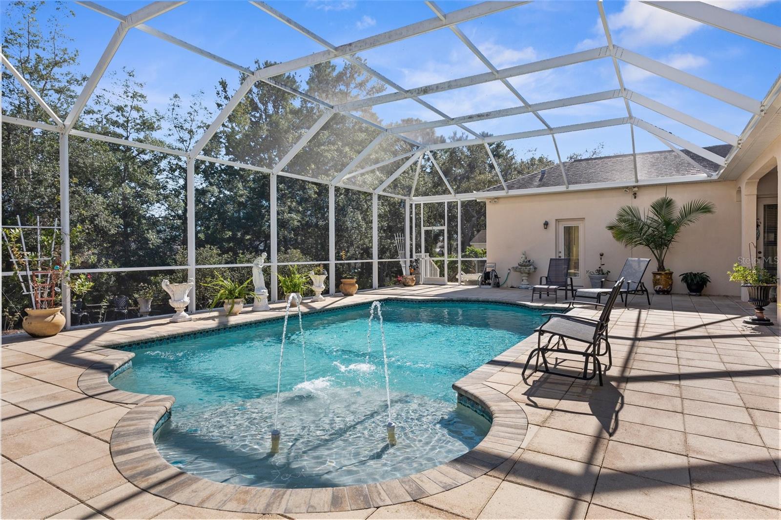 Gorgeous heated salt-water pool with large screen enclosure and private feeling backyard.