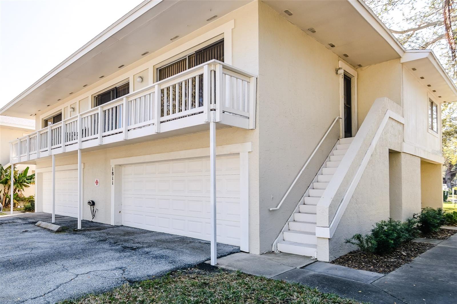 Garage is on the side of the townhouse - front door is around the right side on the first level