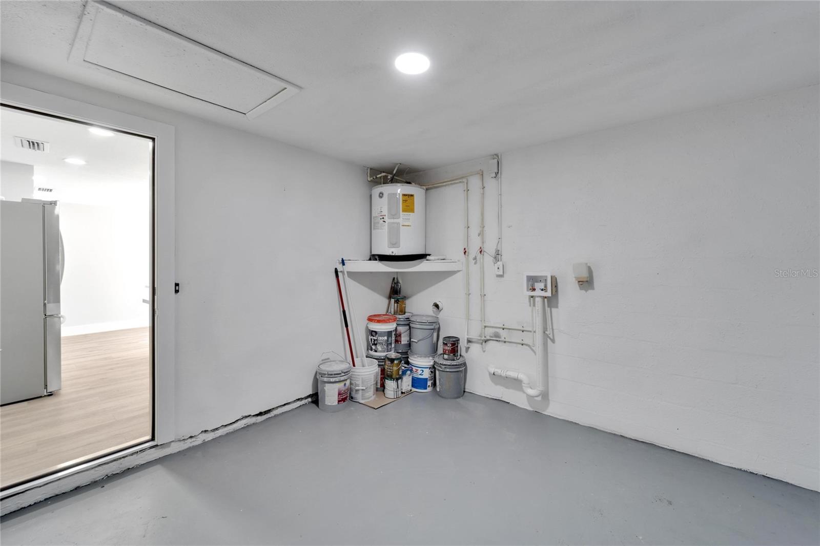 Floor seen in kitchen area in this picture has been updated to porcelain tile seen throughout home