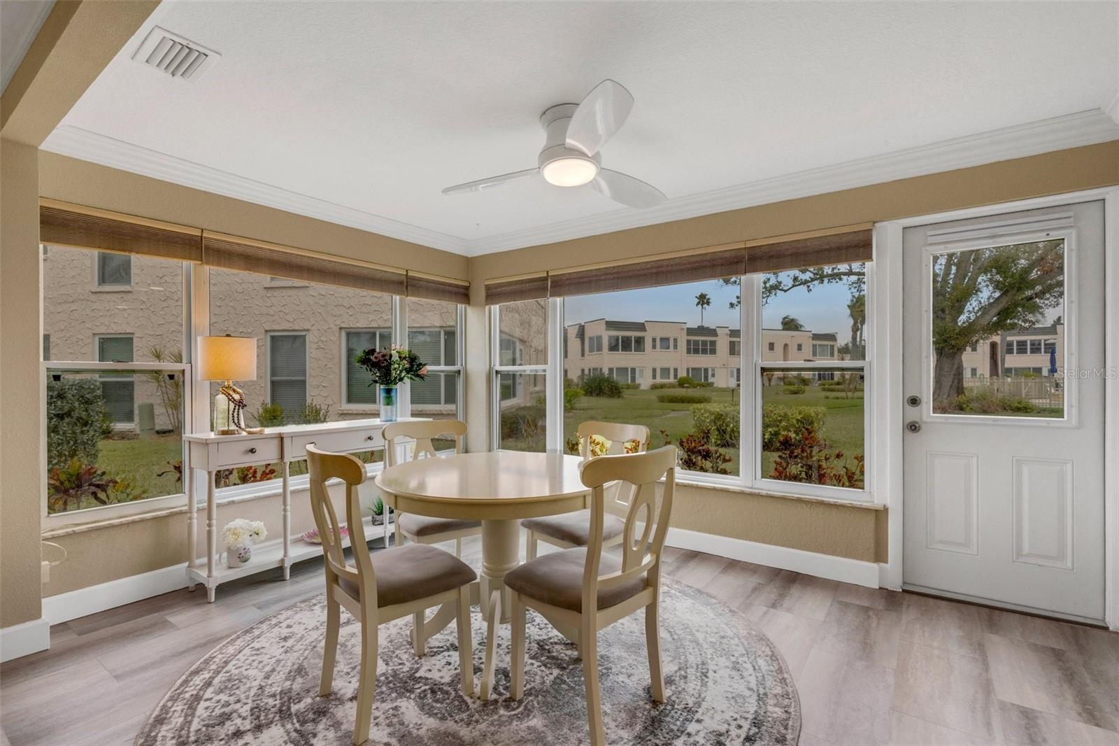 Florida Room / Dining Area with Pedestrian Door to Pool and Clubhouse