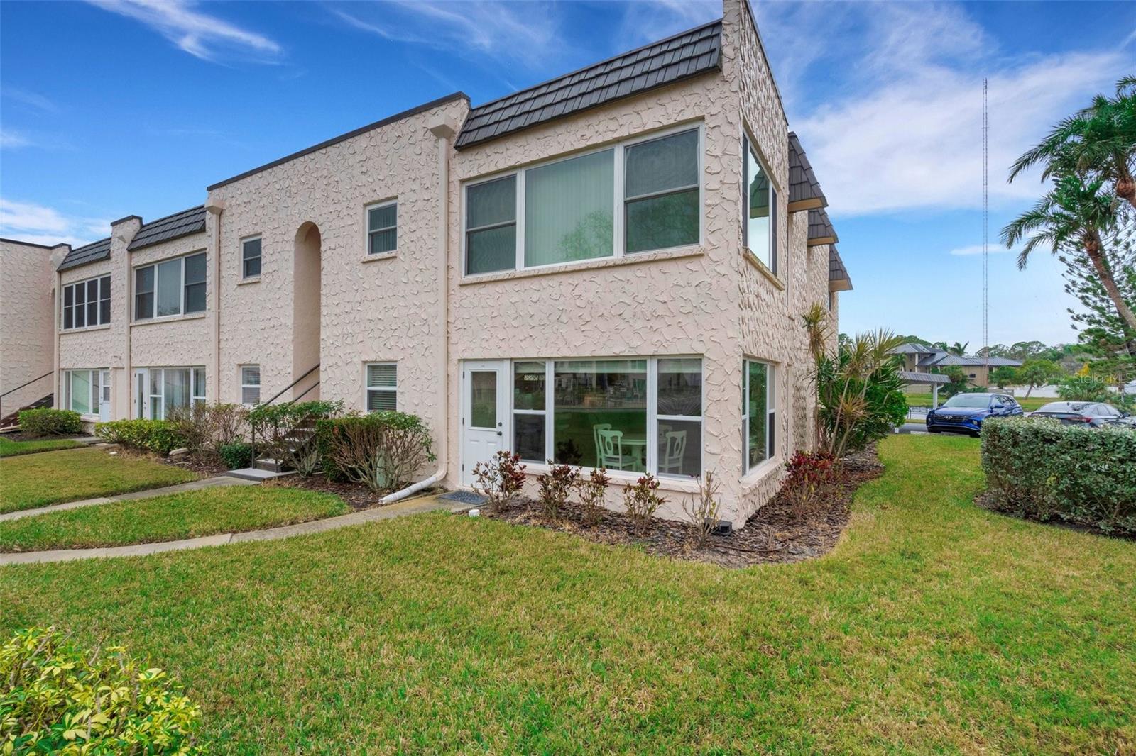 113 Corner Unit with FL Room Pedestrian Door and Walkway to Pool and Clubhouse