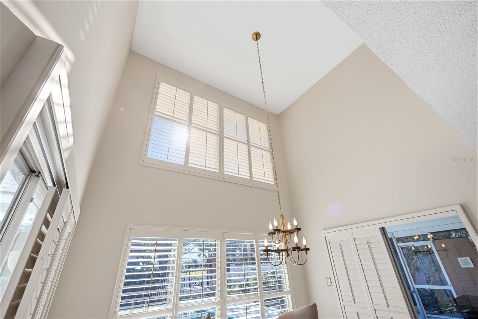 Amazing soaring ceilings in the dinette area off of kitchen with perfect view of the pool