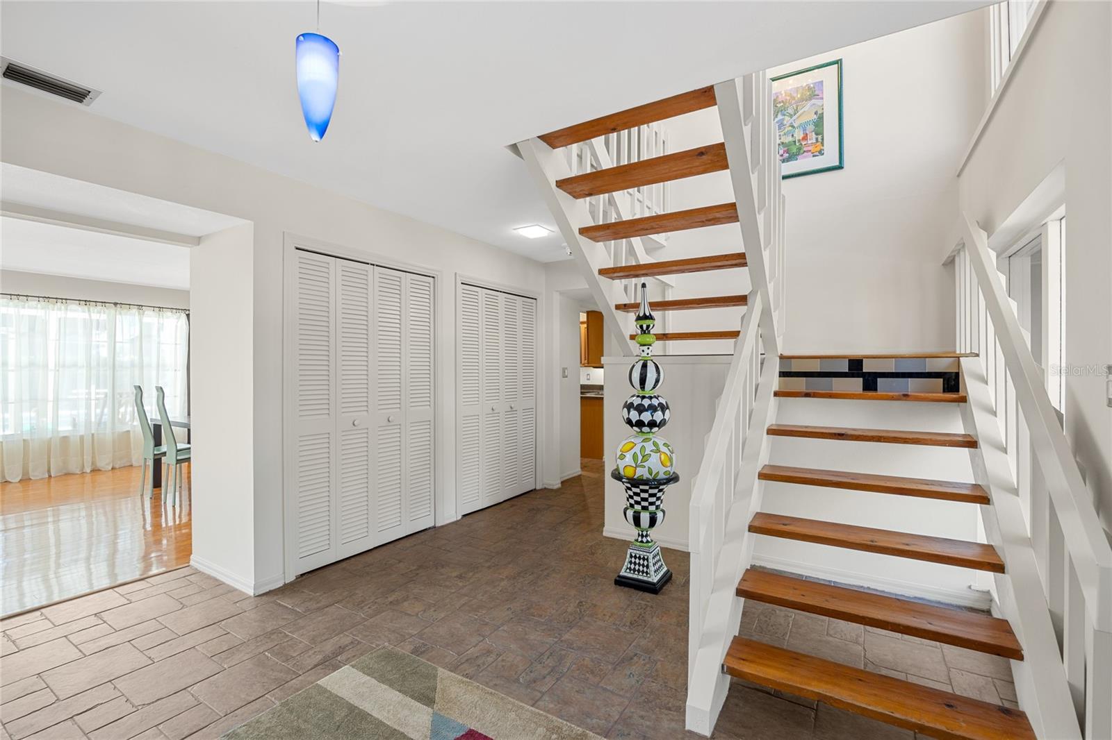 Alternate view in the foyer.   Check out all of those closets as well as storage under the stairs!