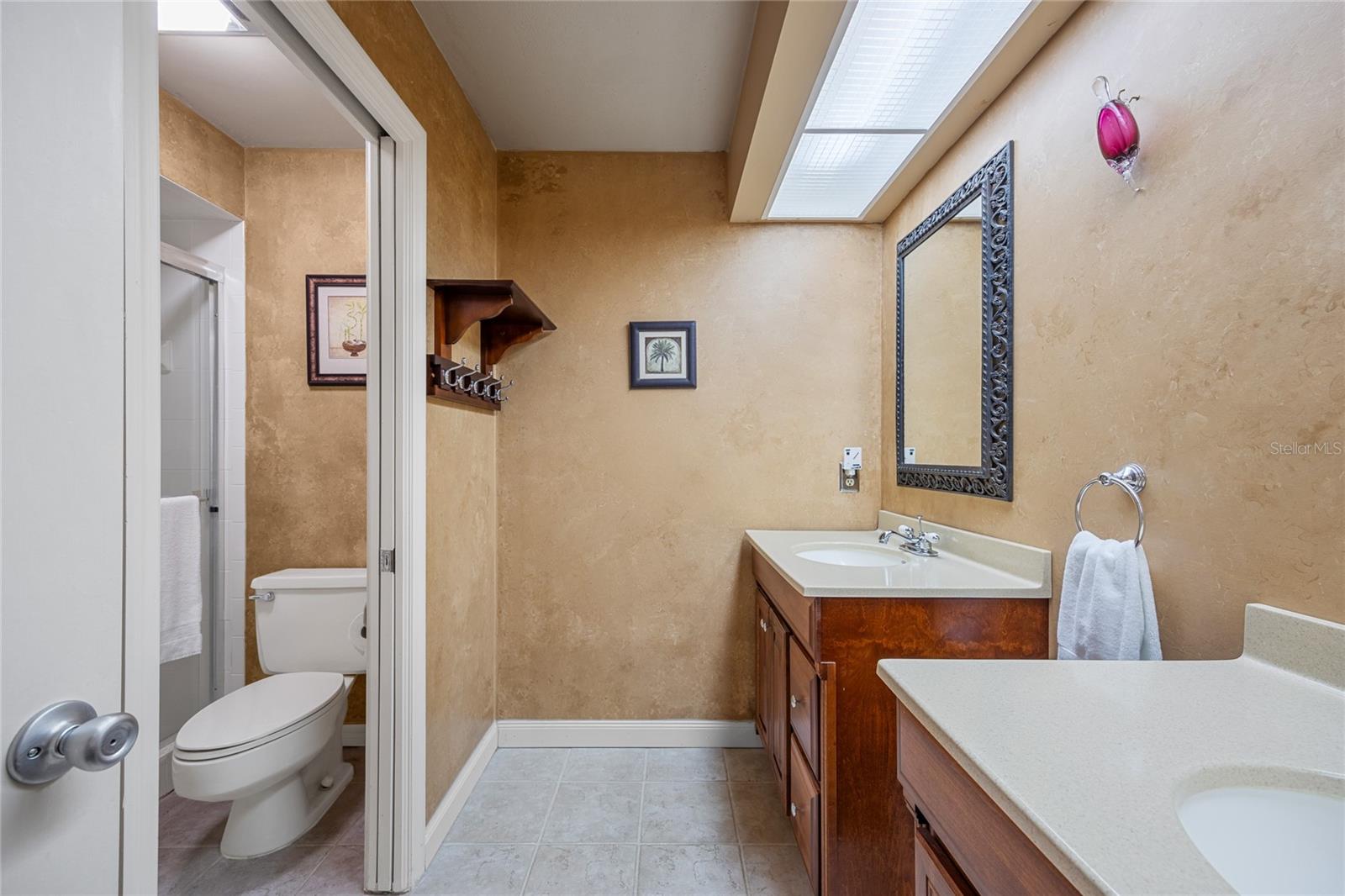 Upstairs Bathroom complete with 2 individual vanities.