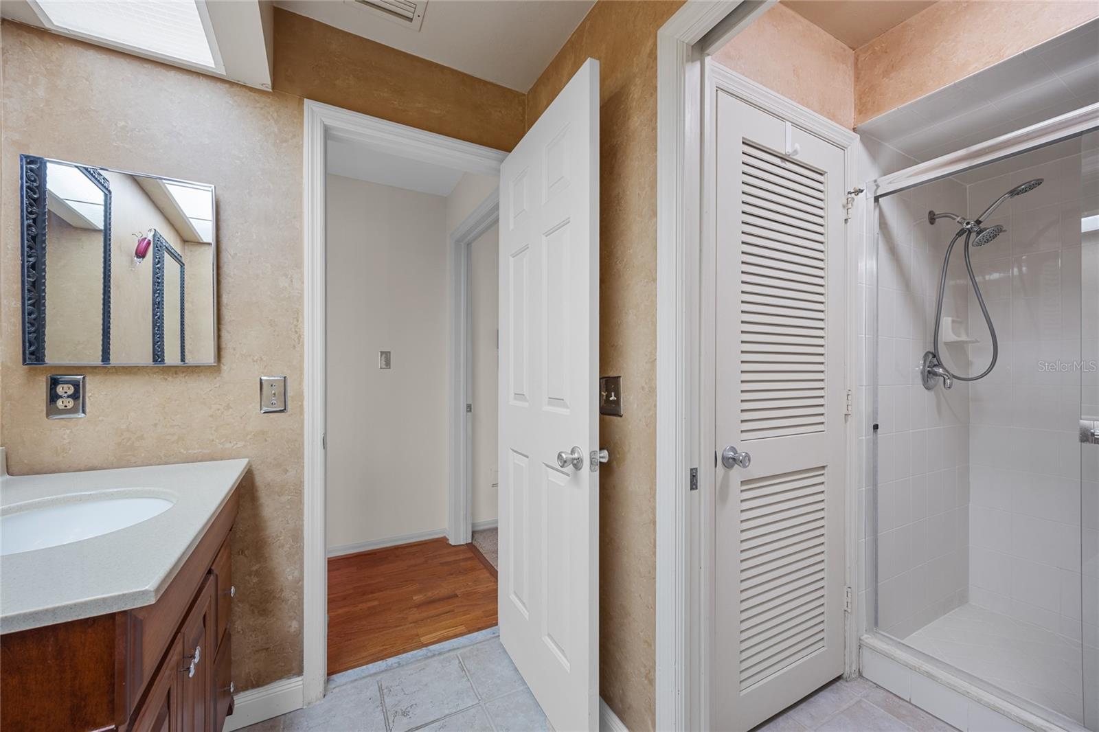 Upstairs Bathroom also has a large linen closet and separate shower and water closet.