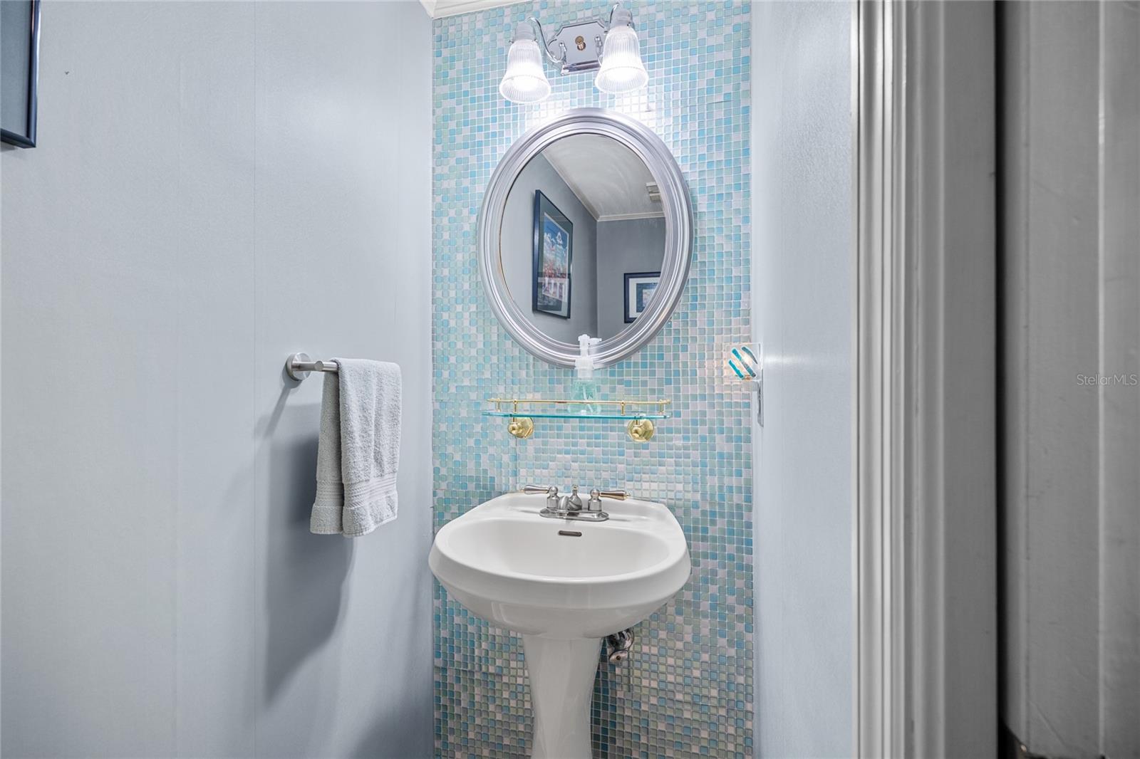 This charming powder room will be perfect for use by your guests!