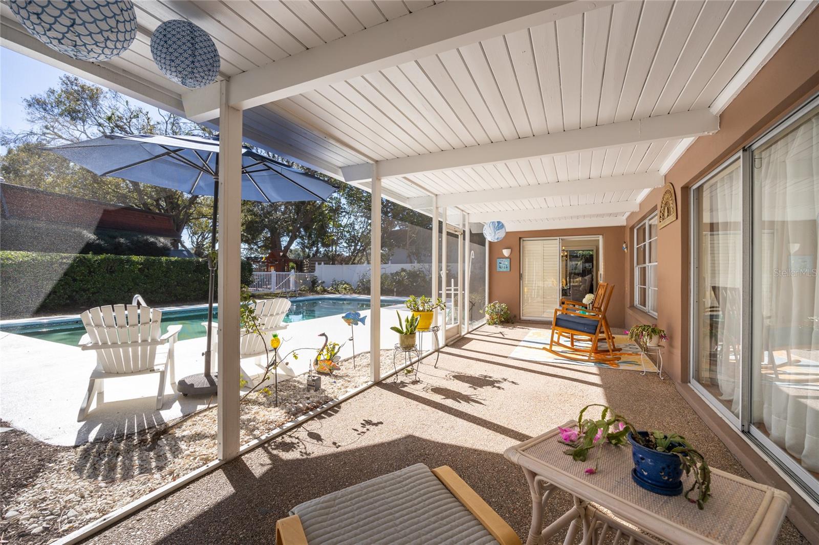 This lanai offers more direct views of the beautiful pool and is accessible as well to the main family room