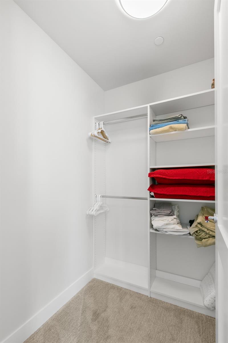 Walk in closet of second bedroom