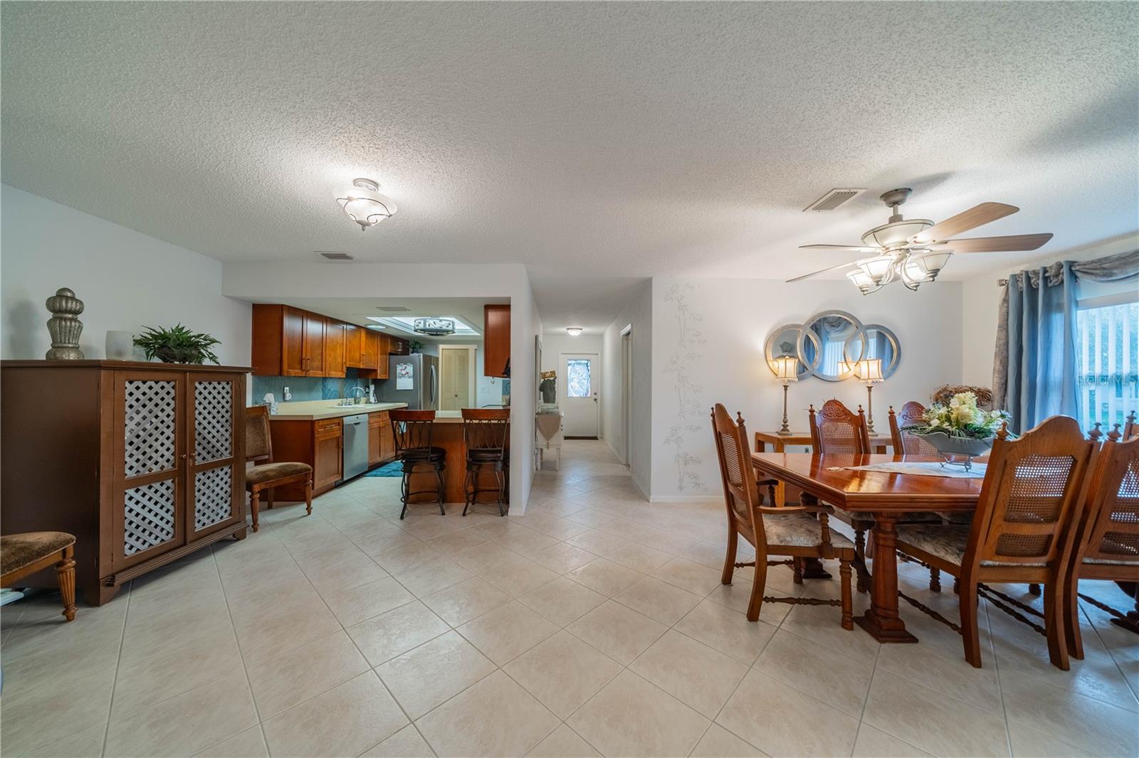 Dining room and kitchen with tile floors