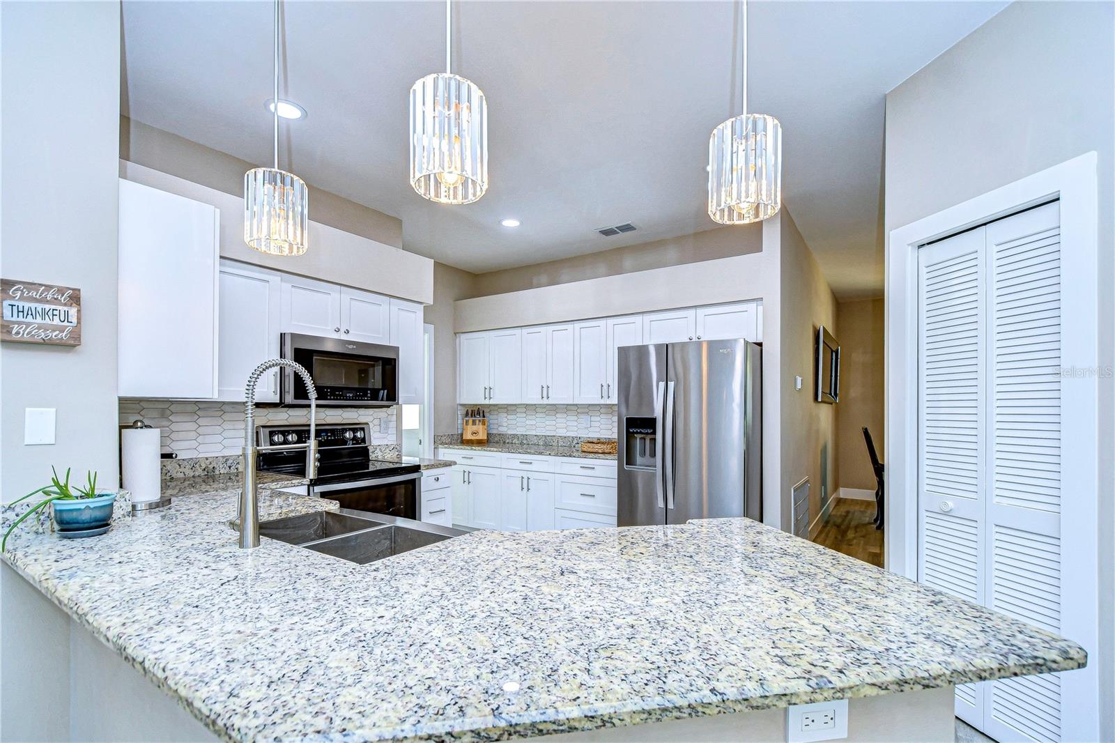 Kitchen includes granite countertops and built-in appliances!