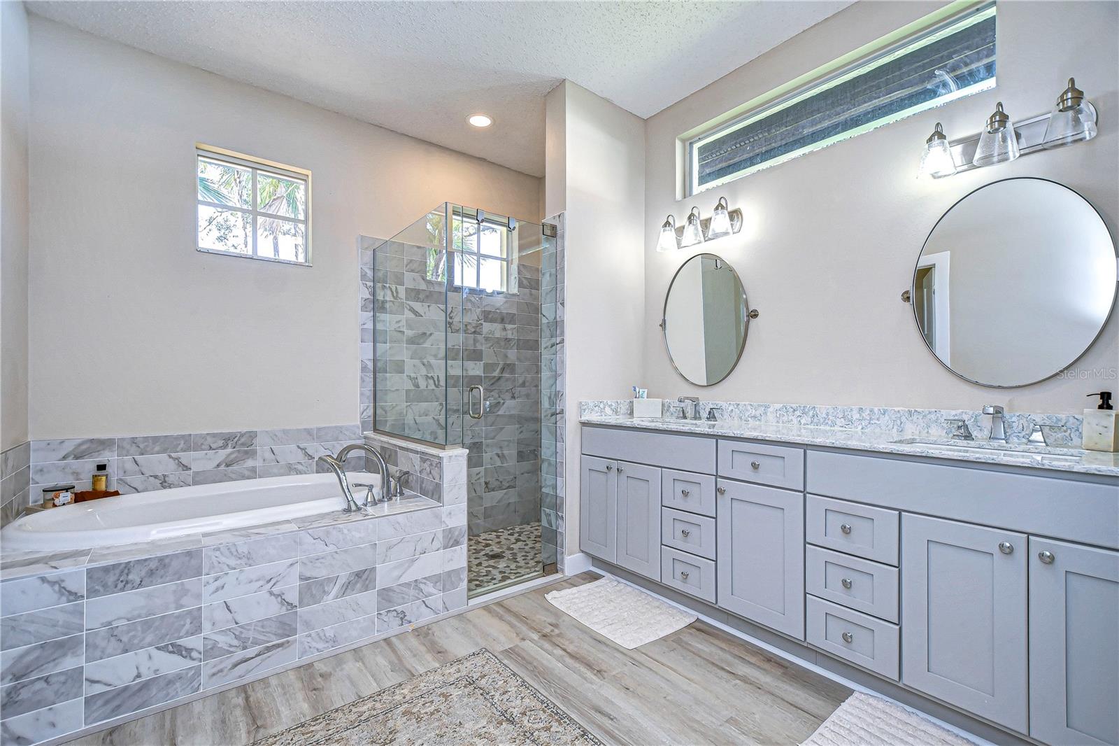 Updated en-suite bathroom features dual sinks and large walk-in shower!