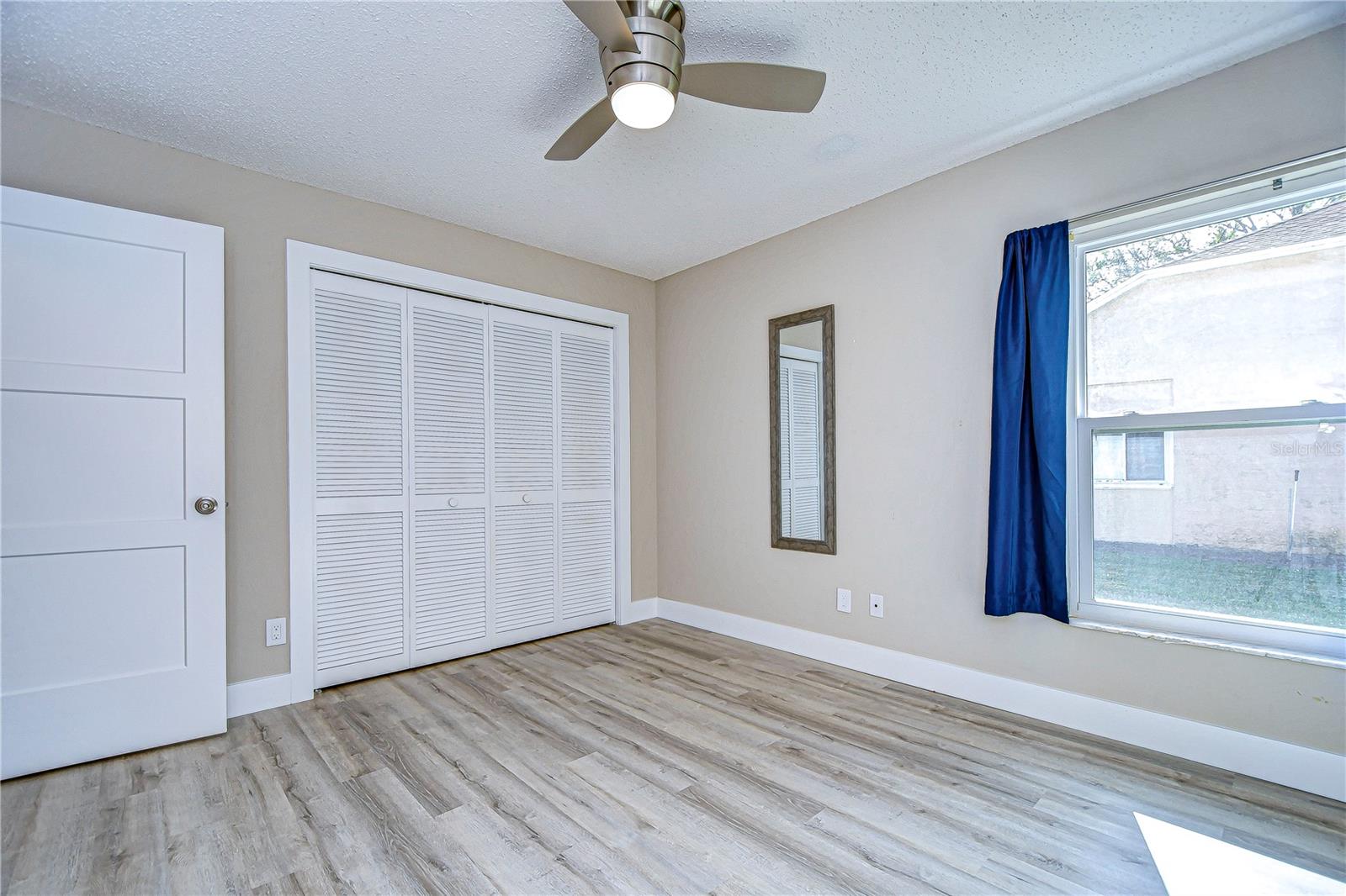 Large closet in secondary bedroom for extra storage.