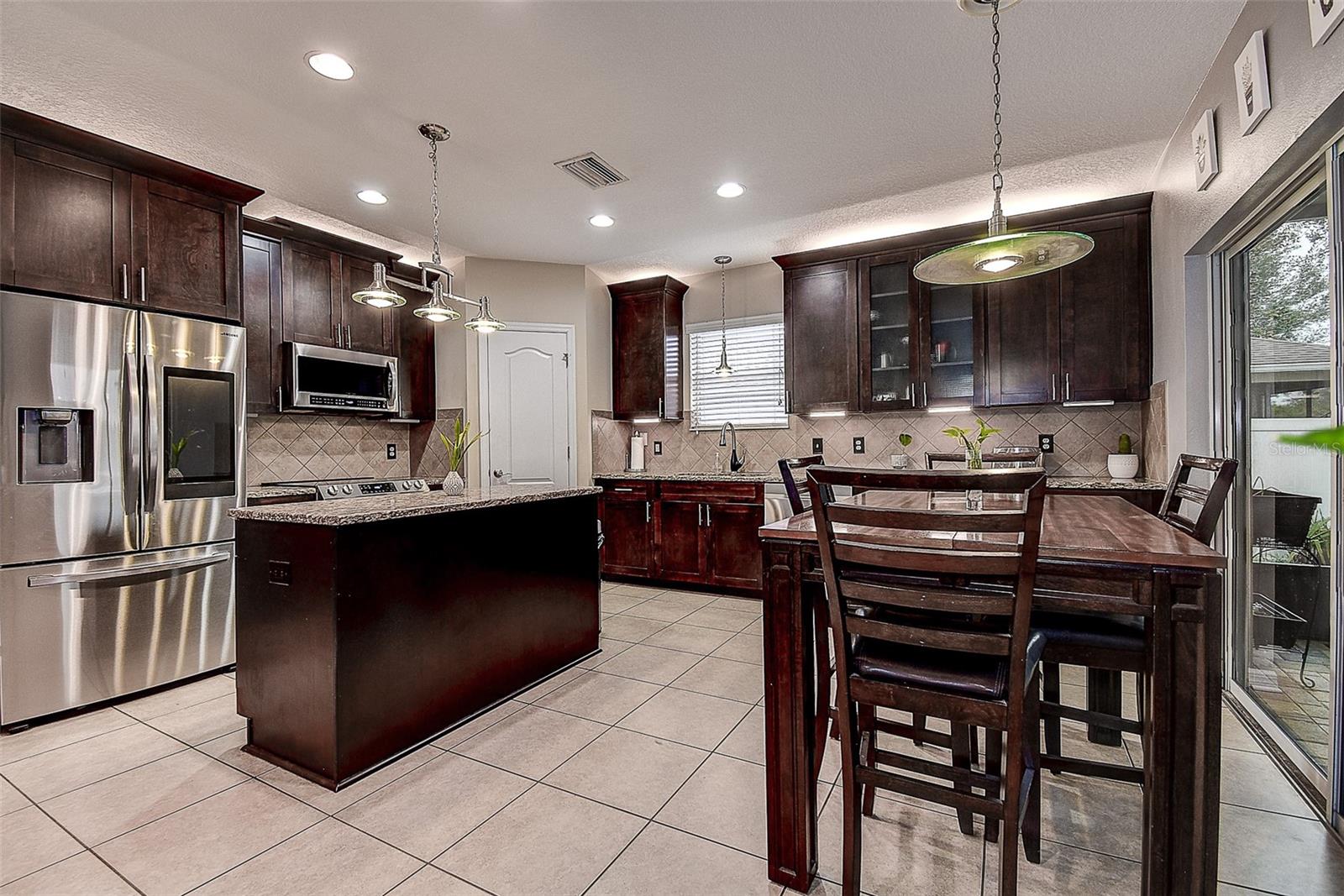 Nicely appointed kitchen with new stainless steel appliances