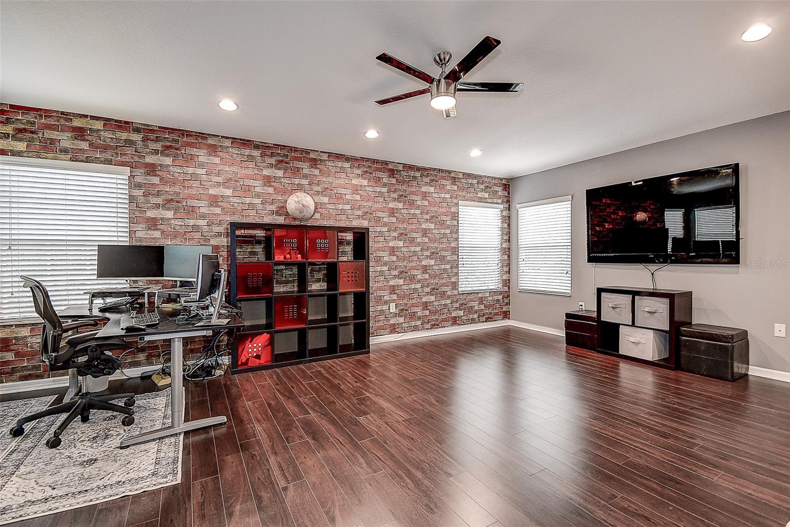 Bedroom 4 with ceiling fan.  Currently office and gym