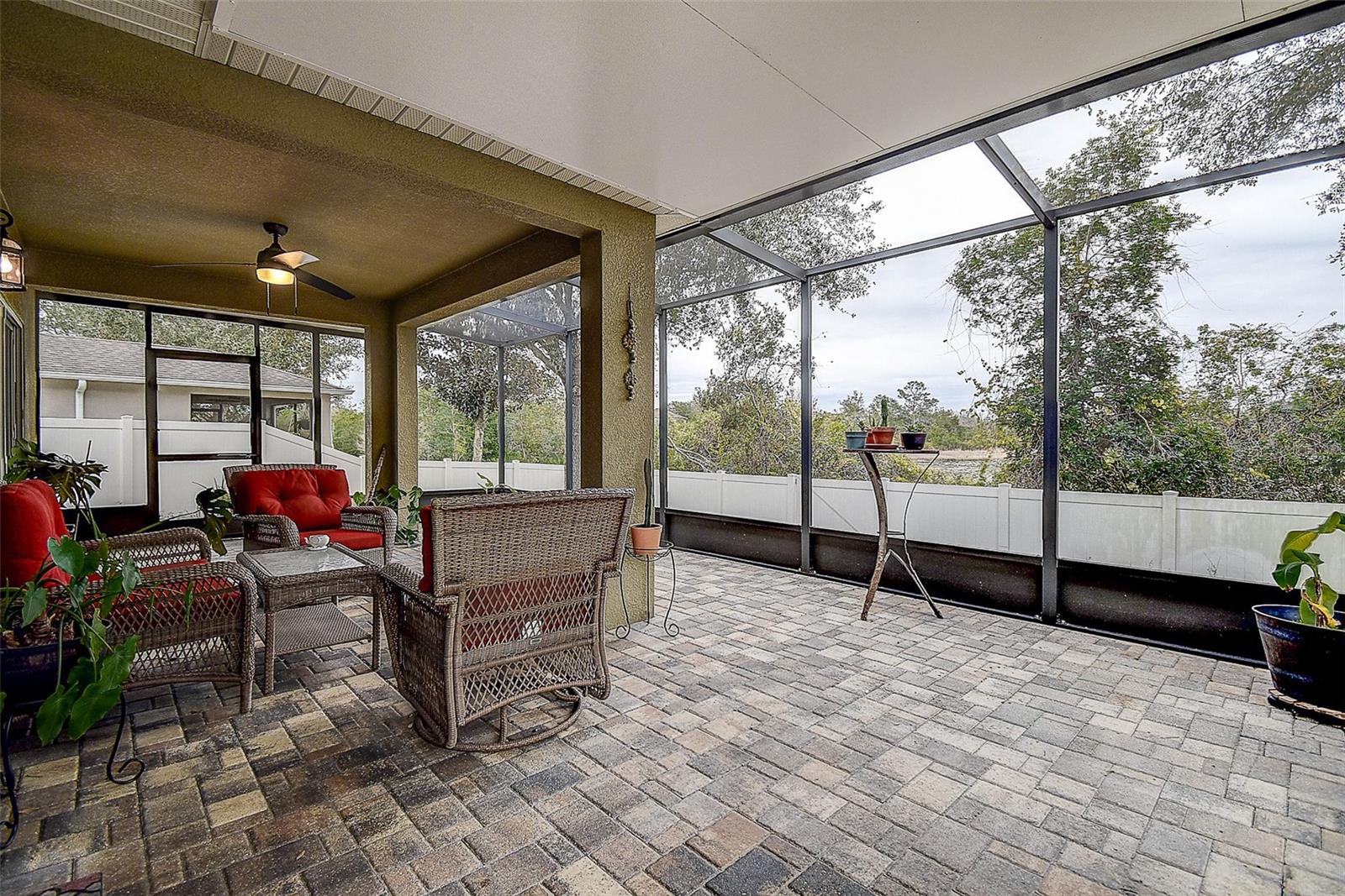 Large screened in and covered lanai with beautiful pavers