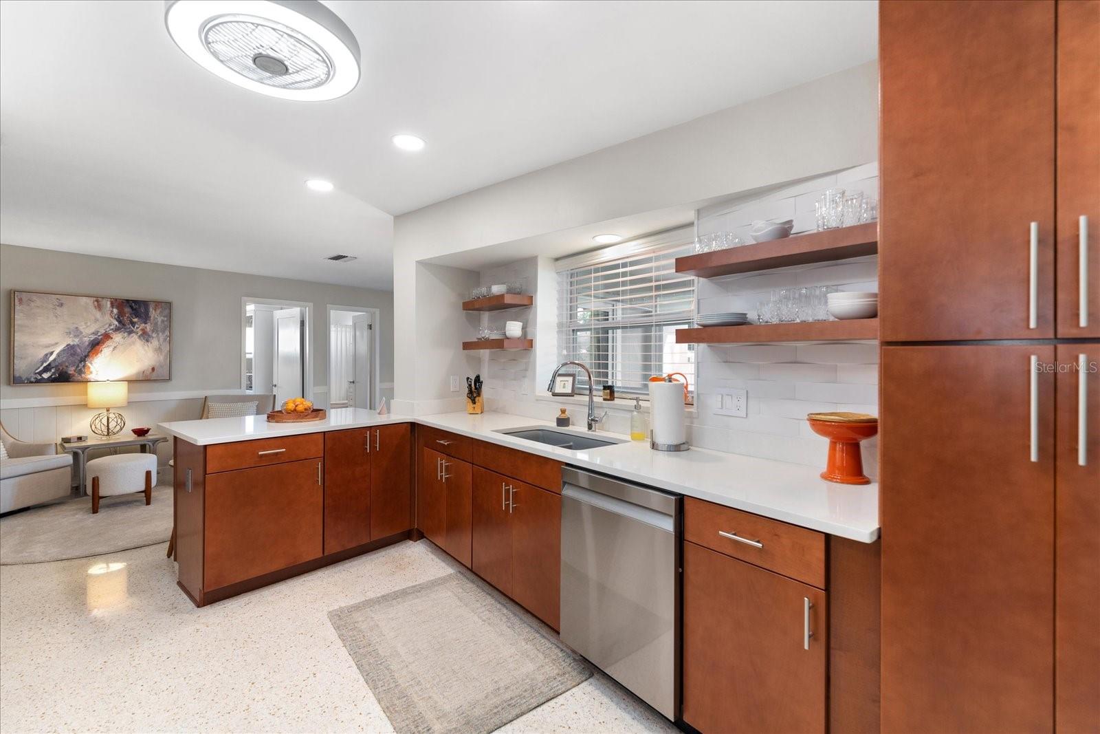 Lots of natural light in the kitchen and a view of the backyard oasis.