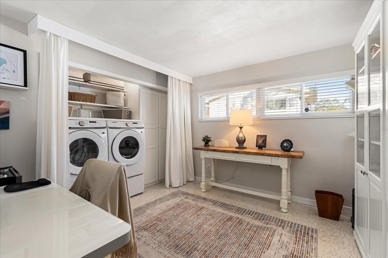 Washer/Dryer in the Flex Room with storage cabinets.