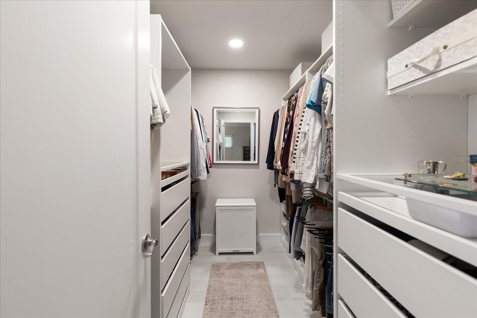 Primary bedroom walk-in closet