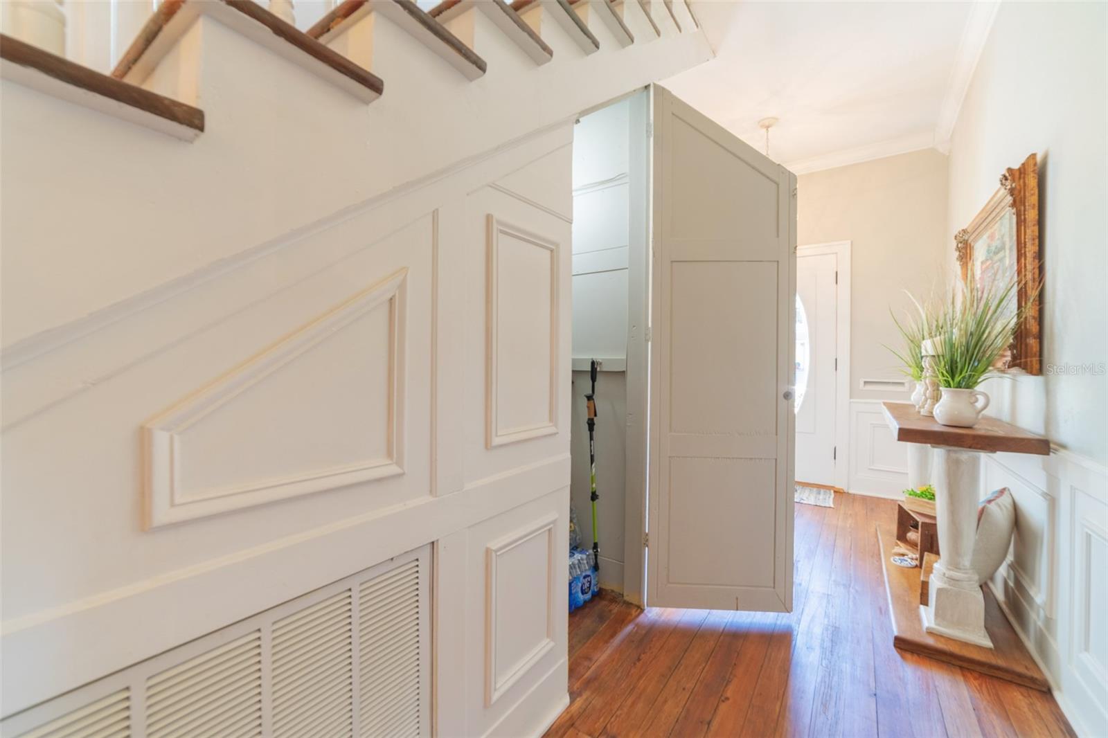 Foyer with under stair closet