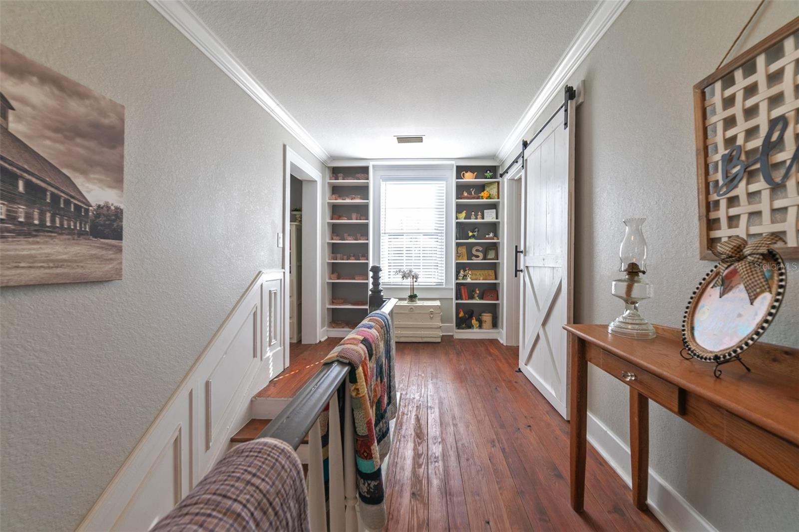 Upstairs Hallway with built in bookshelves