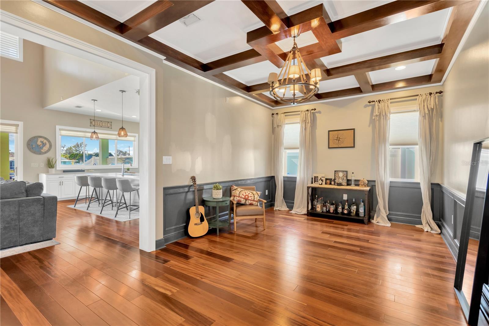 Formal Dining Room, Partial Family Room & Kitchen View! Gleaming Wood Floors, Chair Rail & Bead Board Wanscoting Detail, and Gorgeous Wood Coffered Ceiling!