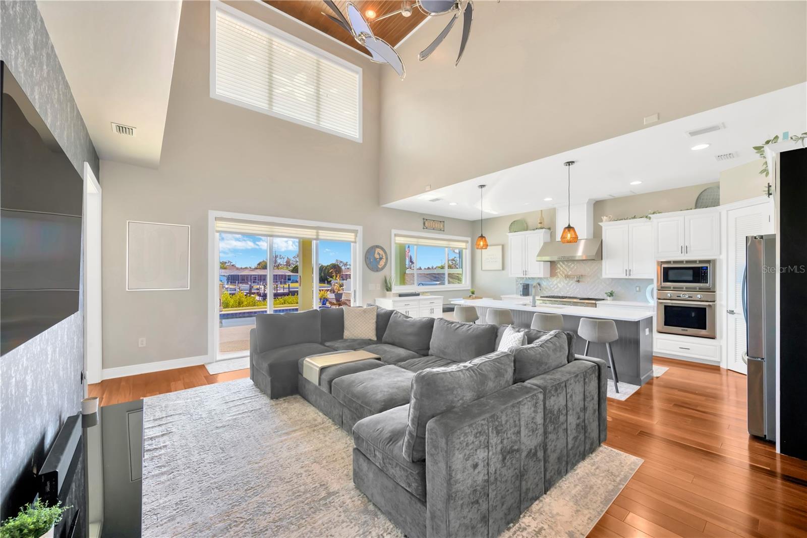 Family Room & Kitchen View! Triple Glass Sliders Here Out To The Oasis!