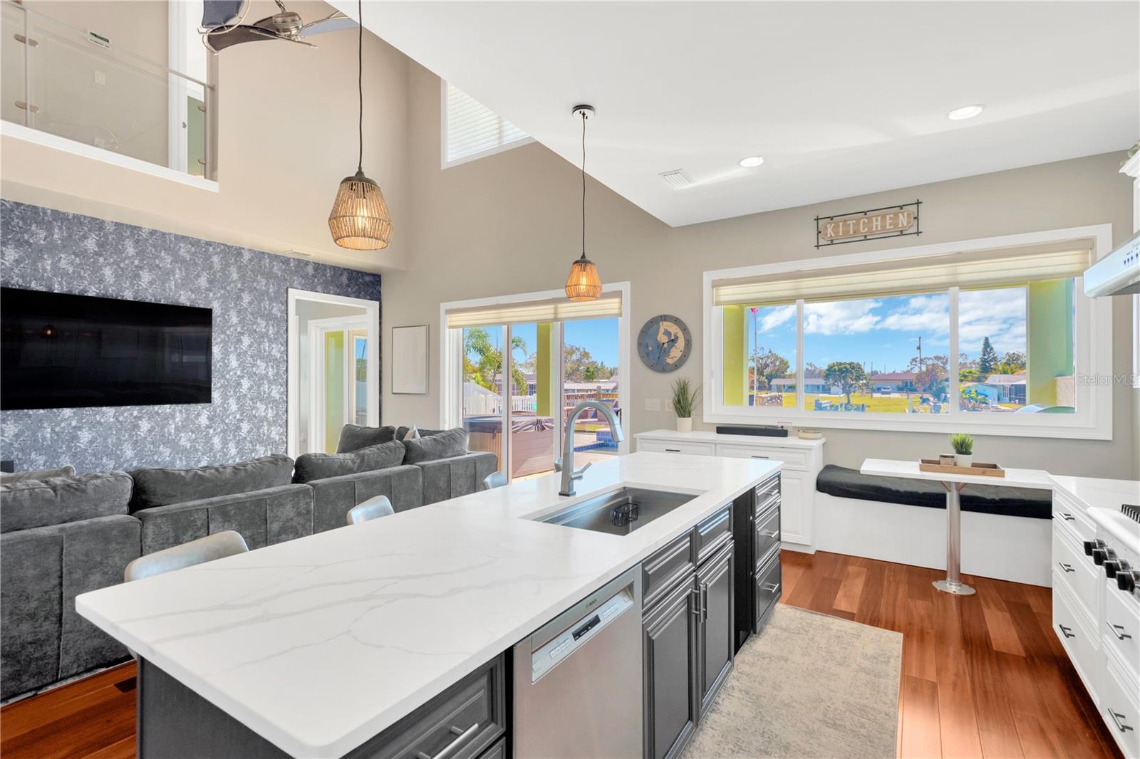 Partial Family Room & Partial Kitchen Views! Notice The L-a-r-g-e Center Sink Island, The Cozy Eat-in Kitchen Banquette, And Those Views Again!