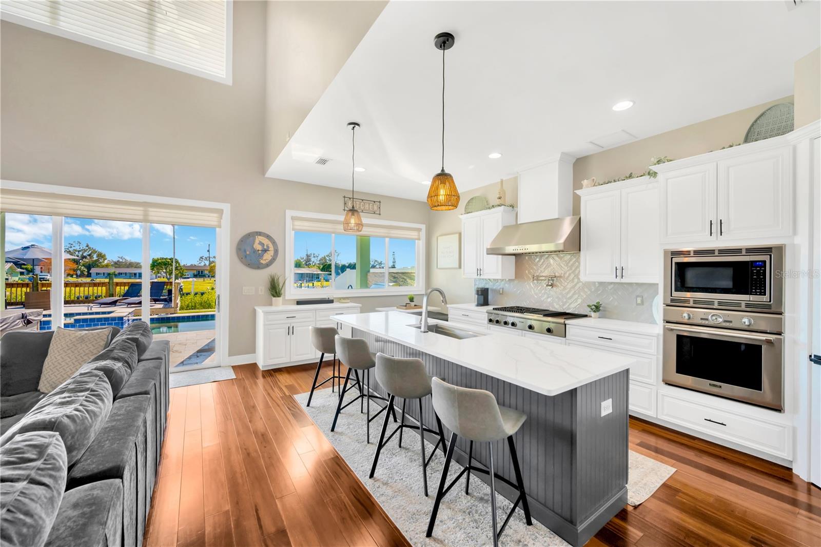 Kitchen View With That Large Center Sink Island & Its 4-Top Snack Bar Space!!