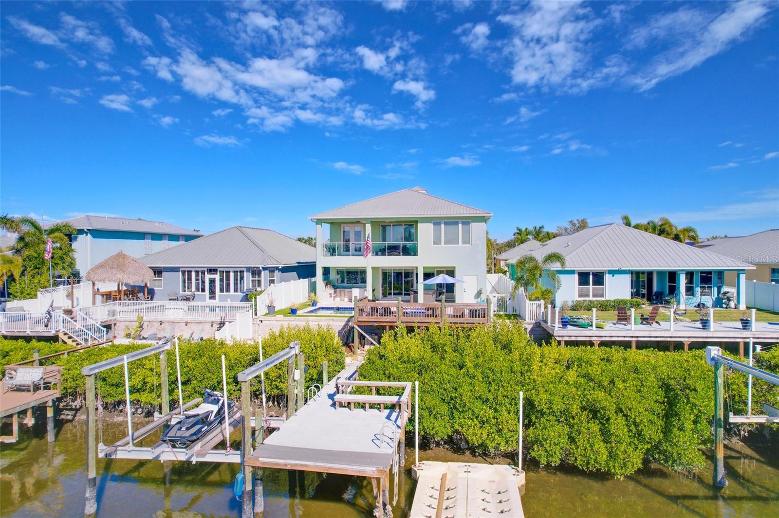 Flamingo Canal View Of The Composite Wood Dock, 16,000lb Boat Lift, And The E-Z Port Jet Ski Docks!