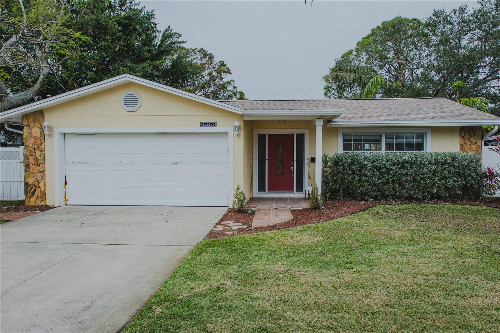 2 car garage, long driveway, and expansive lot