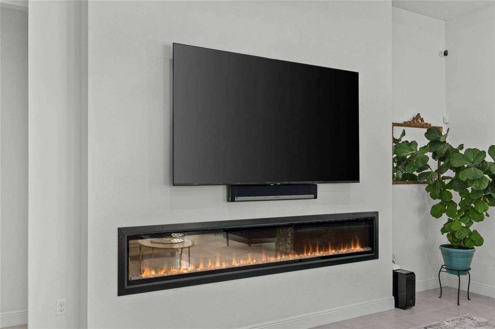 Electric fireplace creates warmth in this famiy room